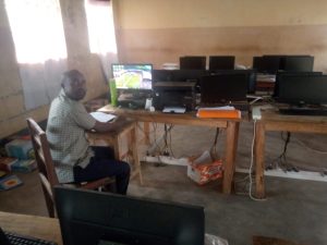 Students working on computers inside the modern ICT laboratory at Ejome Secondary School.